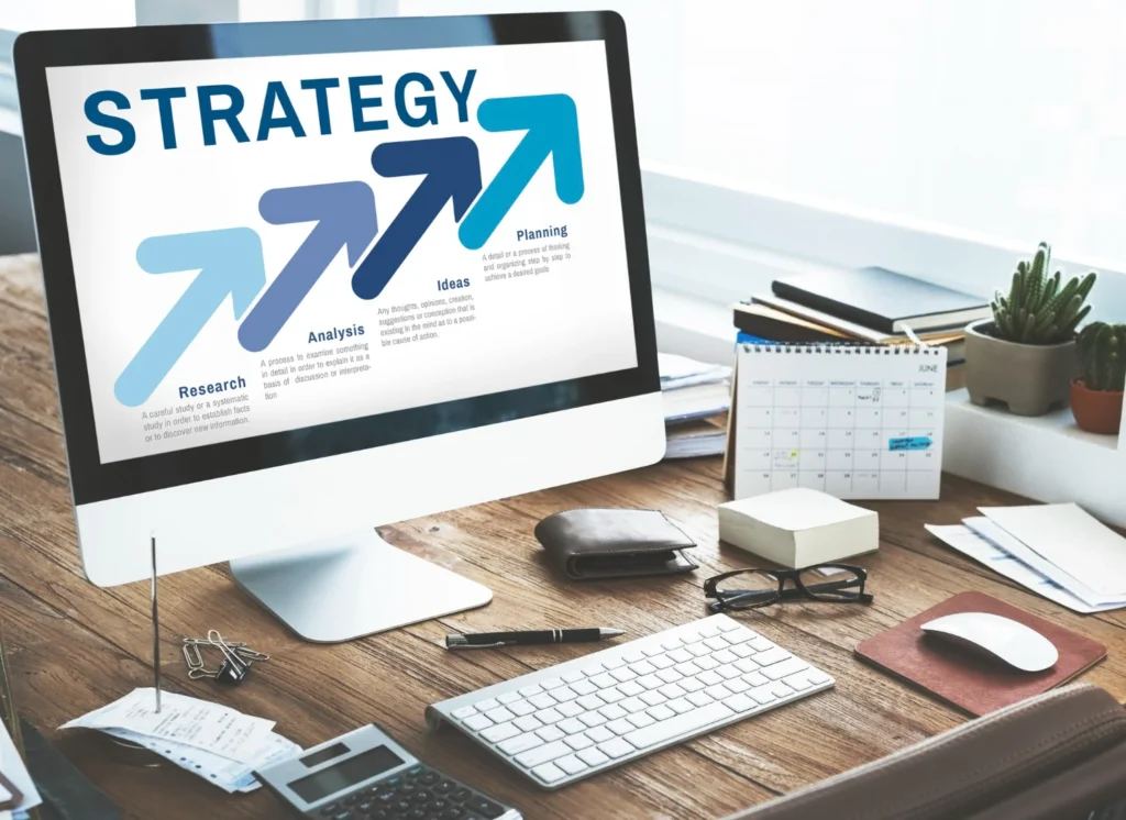 A business owner writing an action plan to reduce cart abandonment on Shopify