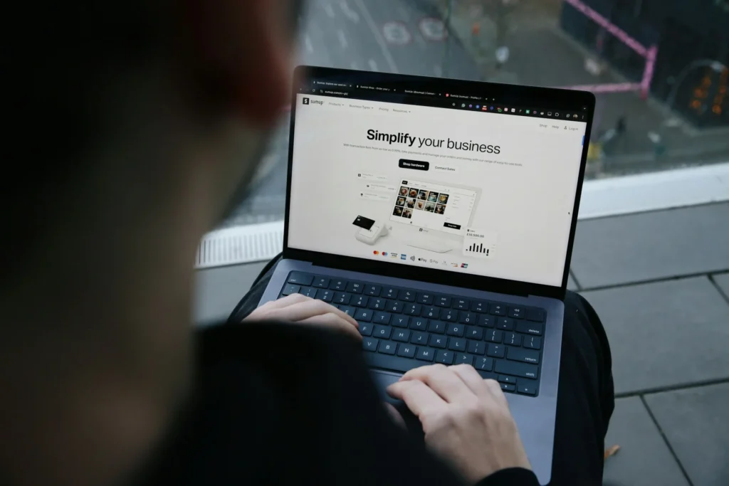A Shopify merchant managing their online store on a laptop