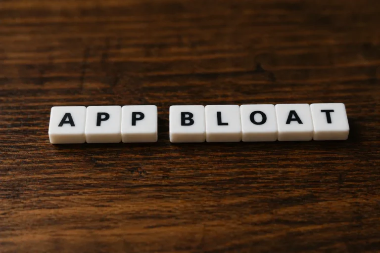 Letter tiles spelling App Bloat representing the definition of App Bloat in Shopify stores